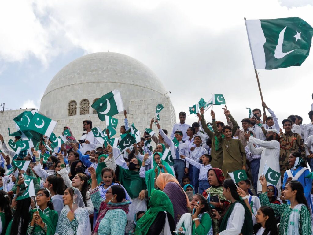 Crowds wave Pakistani flags iduring Independence Day 2025 celebrations, reflecting national pride after the May conflict with India.